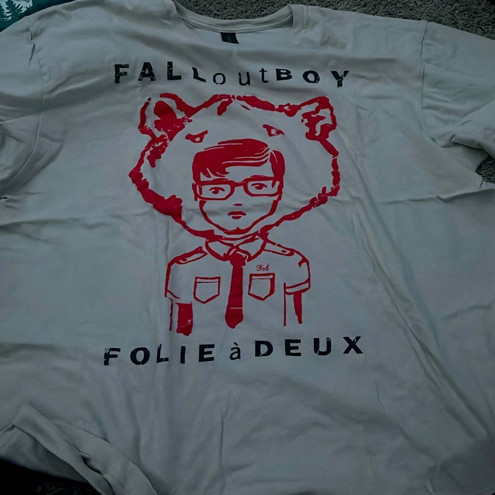 Tan t-shirt with a man wherein a bear hoodie.